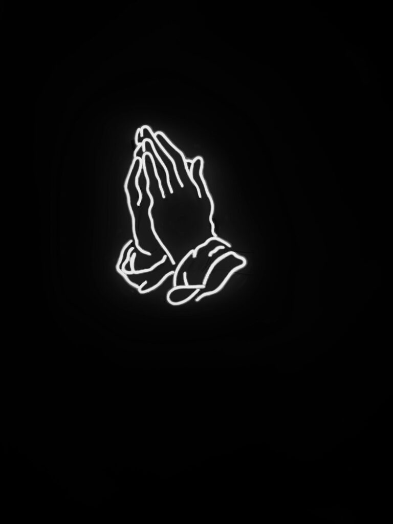 Praying hands neon sign