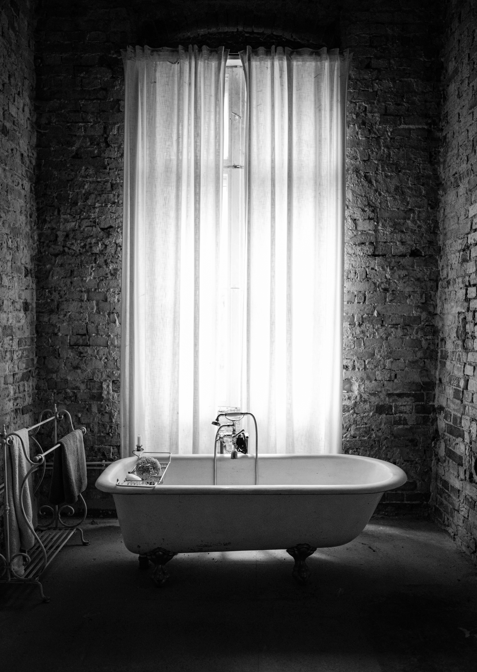 Bathtub near a window