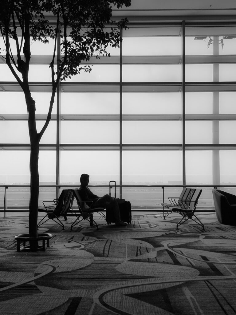 A person waiting for his flight in the airport