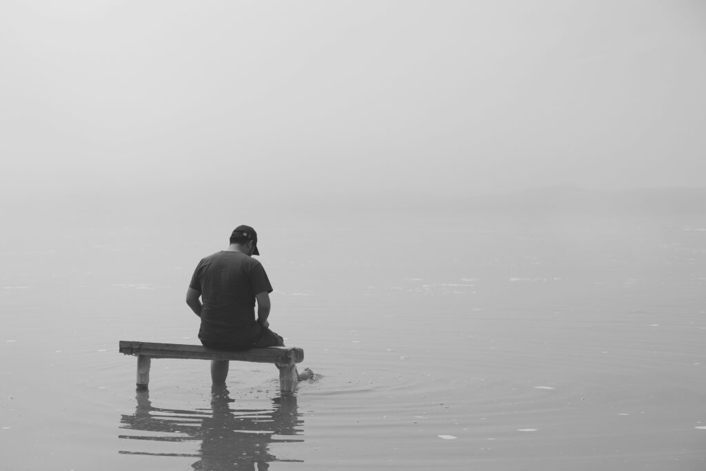 Man sitting on a dock